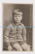 C020292 A little boy with a tie is sitting on a chair. 1927
