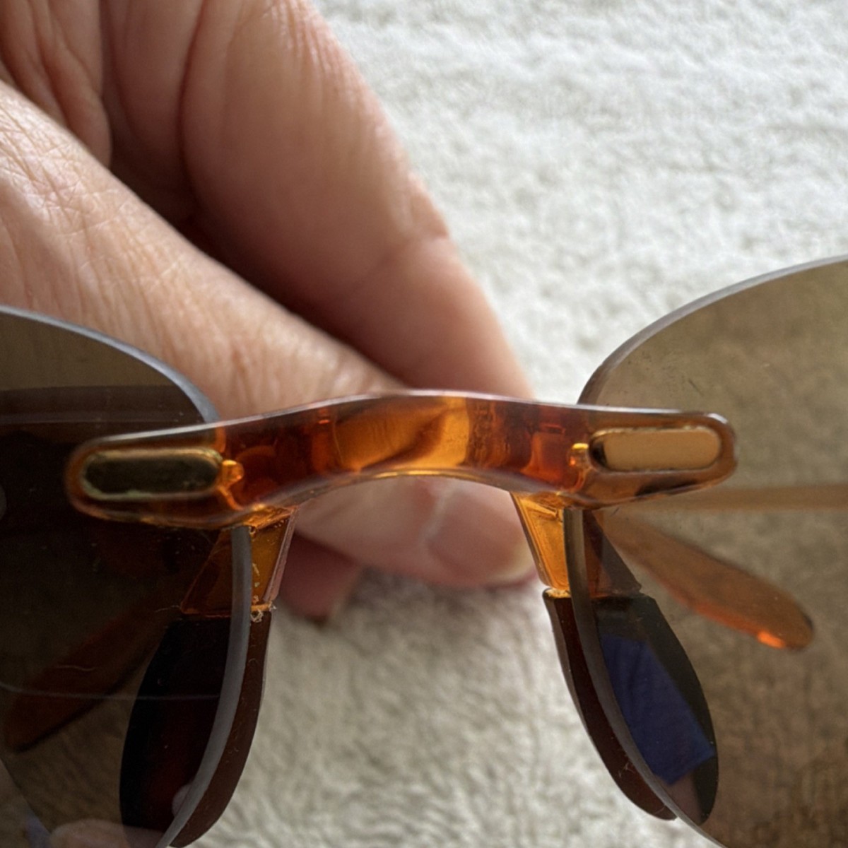 Maui Jim Rimless titanium metal frame sunglasses with Oval Brown Lens Maui Jim Oval Rimless Brown Plastic Frame Brown Lens  main image 3