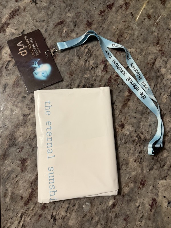 Ariana Grande Eternal Sunshine Tour VIP Pass Blue Lanyard, notebook, and bag