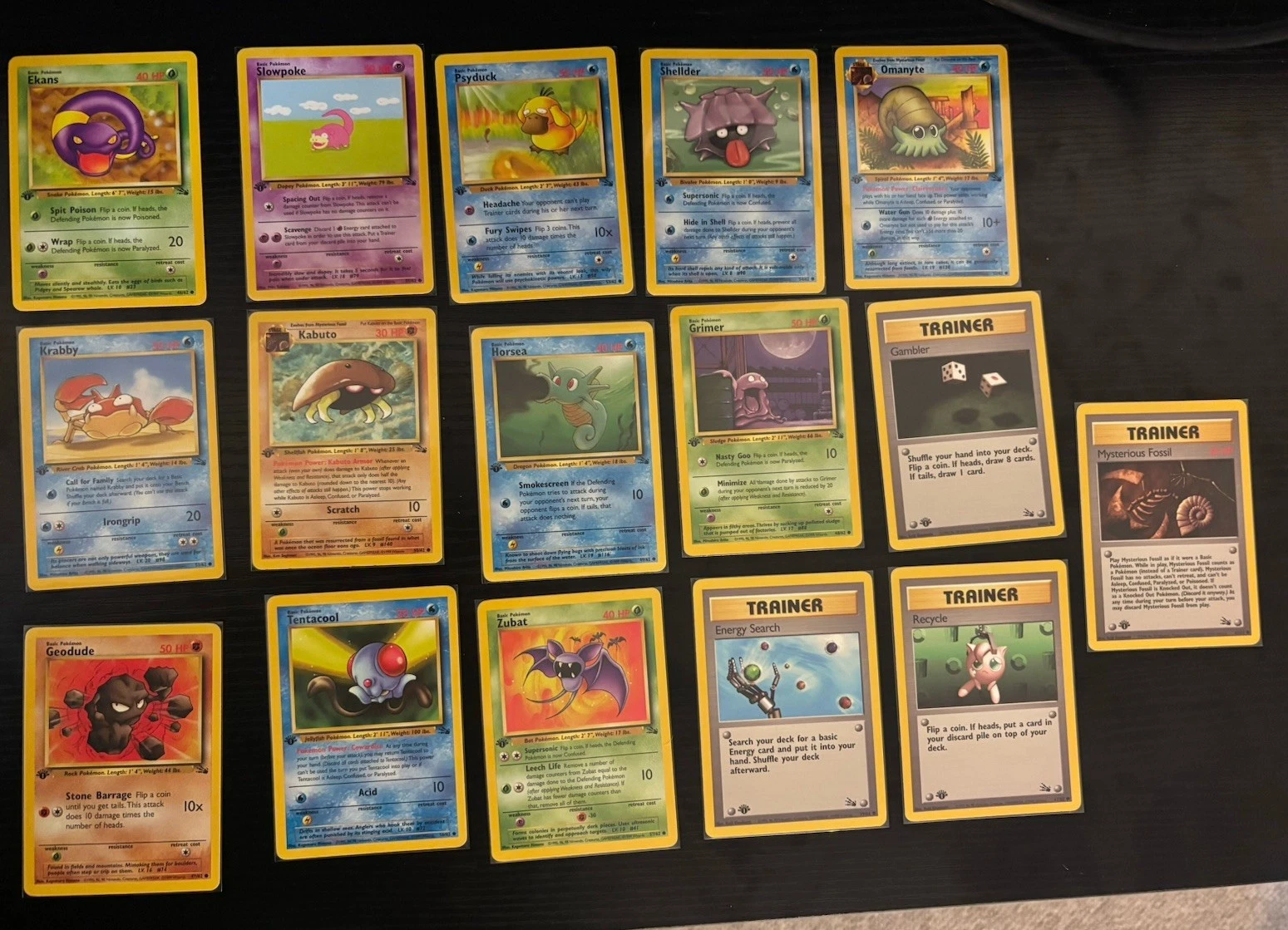 A grid of vintage Pokemon holographic cards
