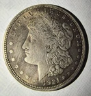2- 1921 Morgan Silver Dollars 1- with Reverse Retained Lamination