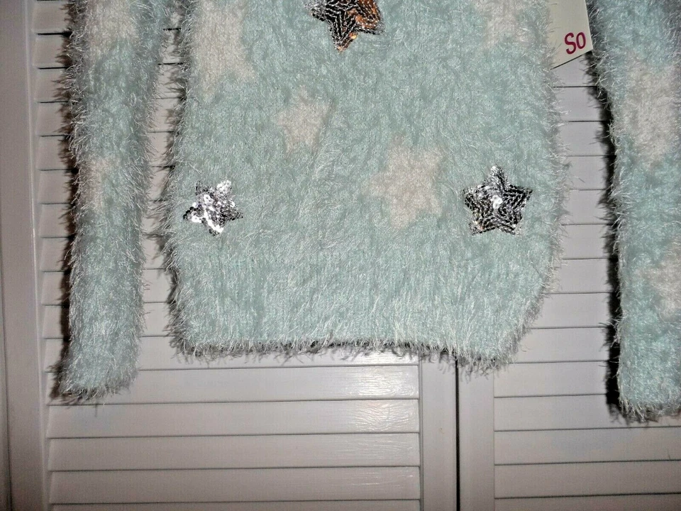 Suéter Pretty SO Niñas Talla 7 Como Nuevo Verde Blanco Estrella Plata Lentejuelas Estrellas Nuevo Con Etiquetas Foto 2 de 4