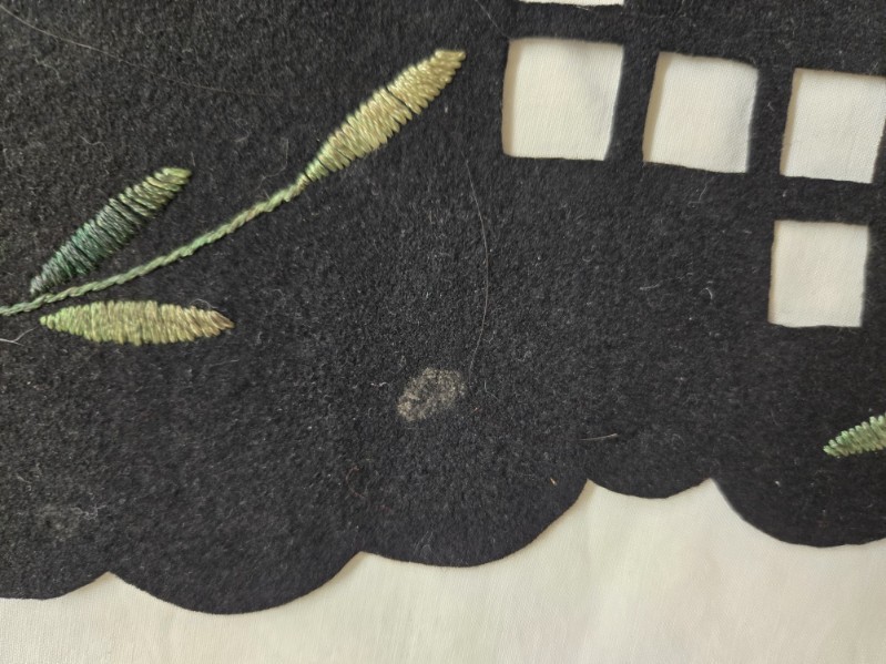 Vtg. black felt table runner w/stitched floral designs and cutout areas.