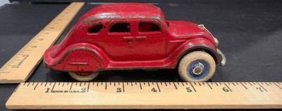 Vintage Arcade or Hubley Red Cast Iron Car with rubber wheels