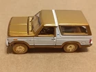 Racing Champions Mint 1980 Ford Bronco Gold Strike