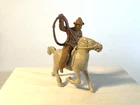 Marx 1950's 60mm plastic brown Chubby Cowboy with lasso on galloping horse.