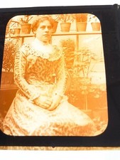 MAGIC LANTERN SLIDE PHOTOGRAPH WOMAN SITTING IN GREEN HOUSE c1900
