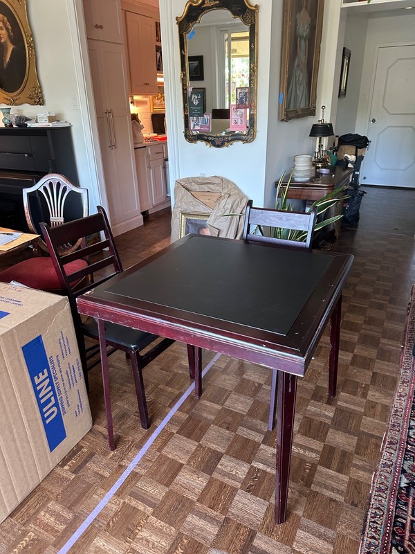 gently used folding bridge table+ 4 folding matching chairs, black leather top