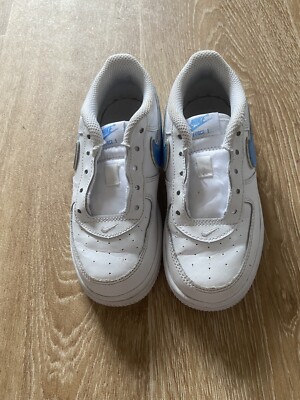 white nikes with blue tick