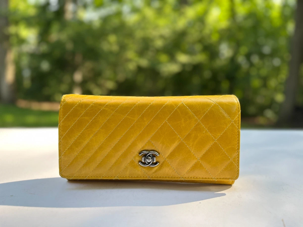 Authentic Chanel Aged Creasing Lambskin Yen Wallet in Mustard Yellow