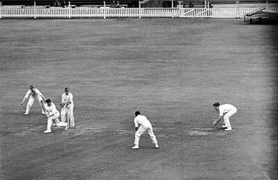 Oxford Universitys Brian Boobbyer stoops to field a leg gl - 1951 Cricket Photo