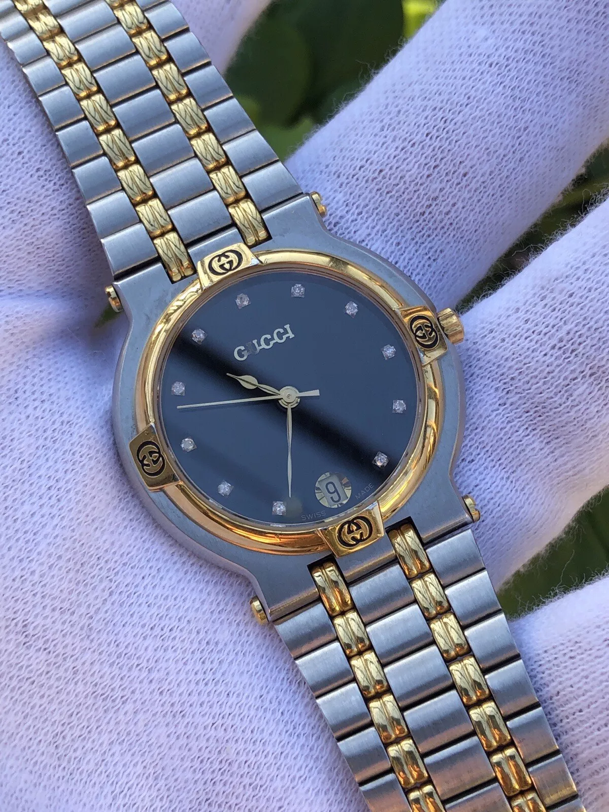 Montre Gucci vintage 9000M, lunette diamant + marqueurs heures, acier inoxydable + or 18 carats unisexe
