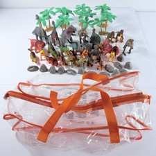 Large Lot of Dinosaur Plastic Figures Trees Rocks Comes W/ Clear Tote 49 Piece