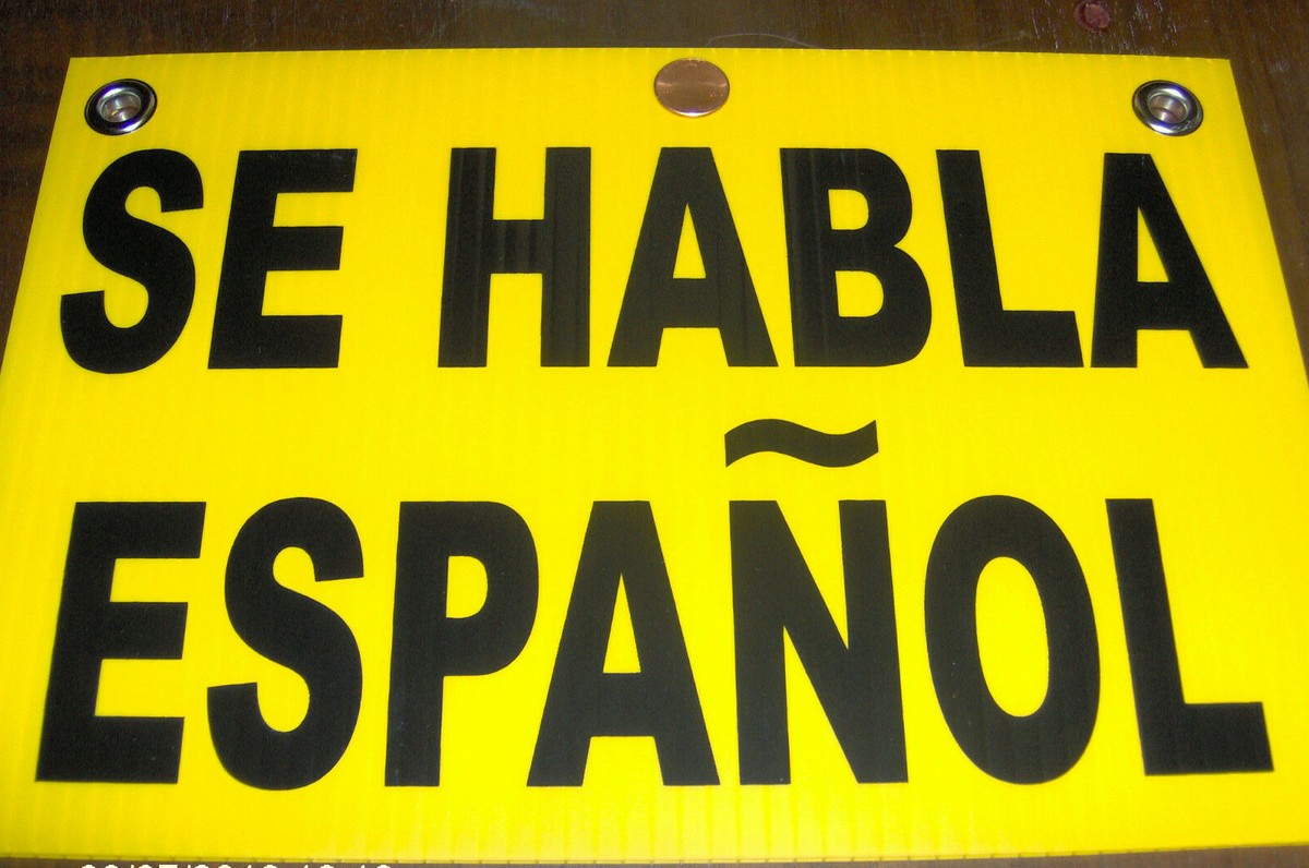 Se Habla Espanol Sign Window