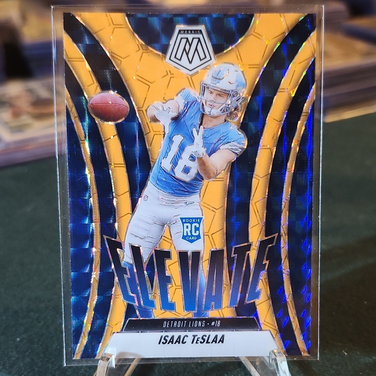 2025 Panini Mosaic Orange Elevate Prizm Isaac TeSlaa #8 Lions NFL Rookie (RC)