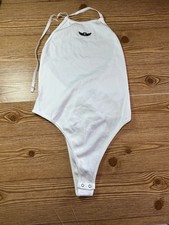 Women s White Halter Neck Ribbed One-Piece Bodysuit Snap Crotch Logo Strap