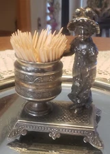 Kate Greenaway  figural toothpick/Matchbook holder Made by James W. Tufts. Rare!