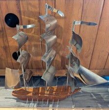 handcrafted vintage metal and wood model sailing ship.
