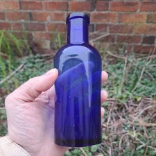 Antique 19th Century deep cobalt blue bottle with applied wide mouth lip.
