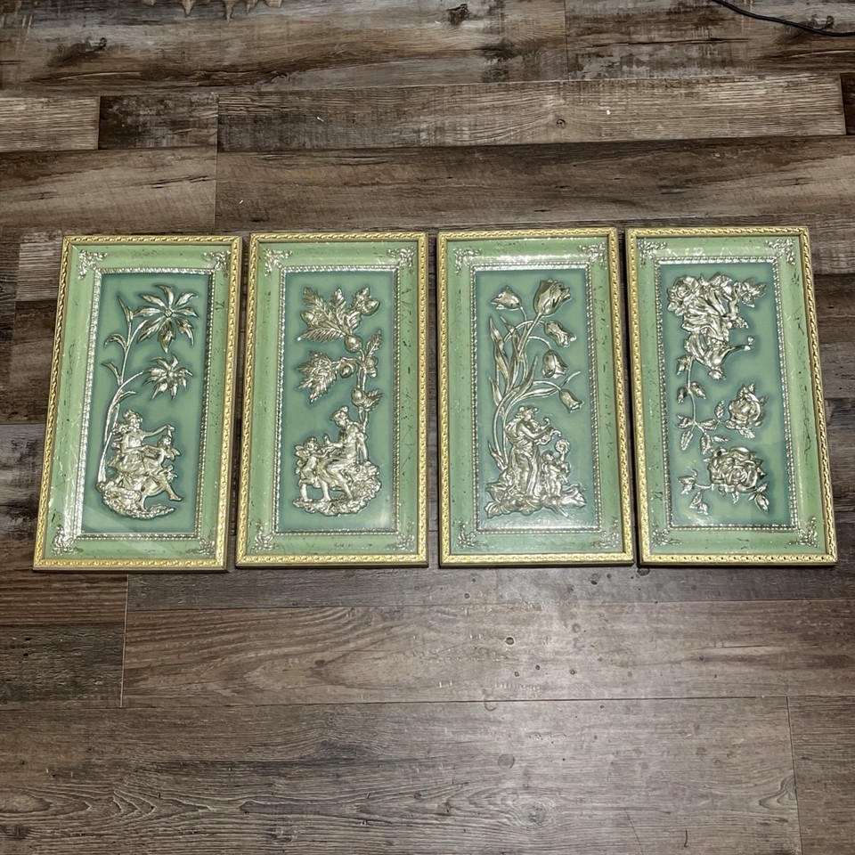 A full set of four 1950s Four Seasons MetalCraft 3D floral wall plaques — genuinely three-dimensional MCM room sculpture, not just a flat print.