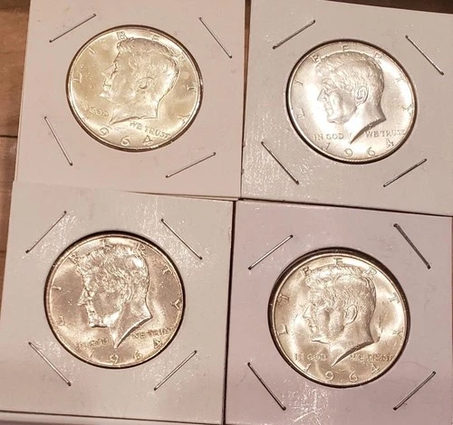Four 1964 Kennedy half dollars