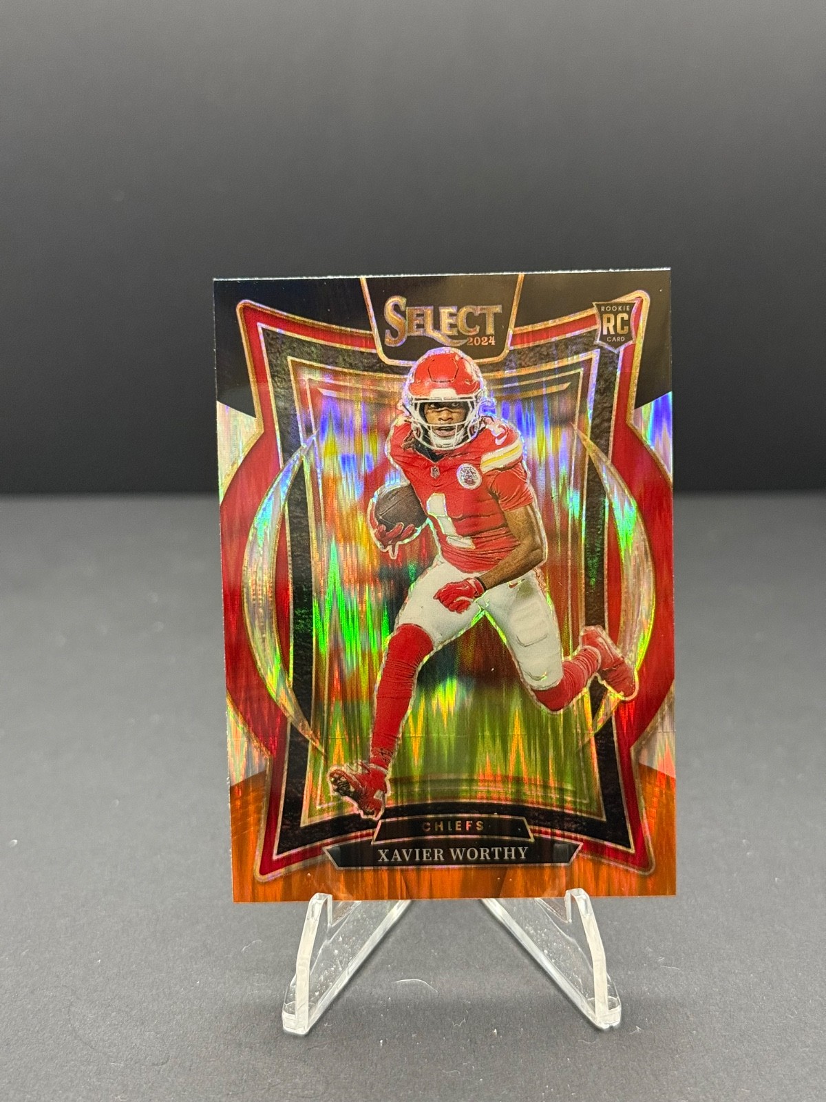 2024 Panini Select - Concourse Xavier Worthy #32 Black & Orange Shock Prizm (RC)