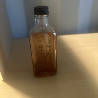 Vintage 5 inch, 2 1/2 Oz Sloan s Liniment Embossed Glass Bottle With Product