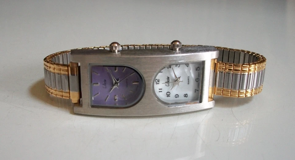 Reloj Mujer Banda Elástica Acabado Plateado y Dorado Doble Hora 2 Zona Horaria Moda Foto 2 de 4