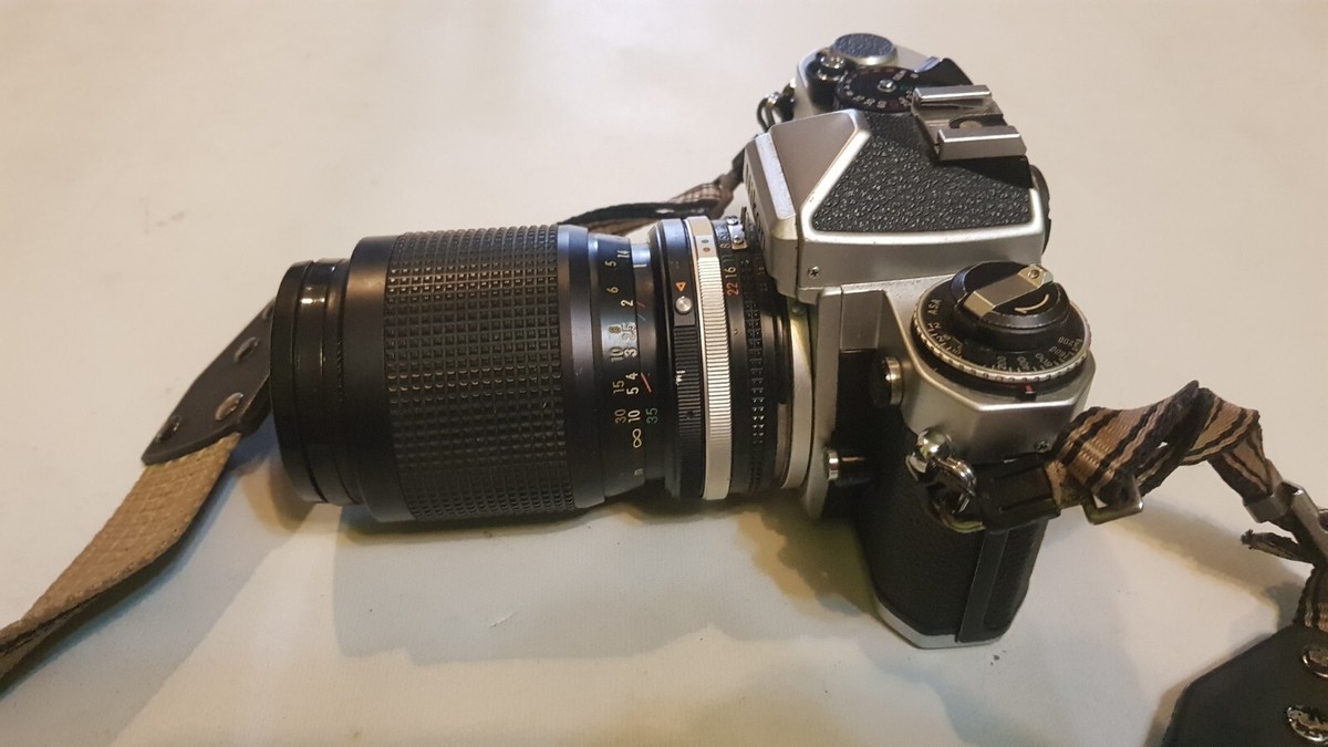 Nikon FE 35 mm. + Flash x2 + Lens 35~105mm. F/3.5~F/4.5 + Straps