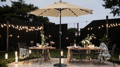 9ft led patio umbrella EliteShade Three-Tier Solar Market Eurmax diameter spanning 64 sq 9ft Solar Patio Umbrella With