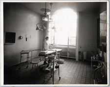 WW1 Photo of Operating Room Nurse Beside Surgical Table and Overhead Lamps
