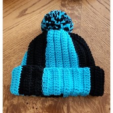 Handcrafted crocheted blue and black winter beanie.