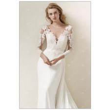 Elegant A-line wedding dress featuring a lace bodice and a flowing skirt