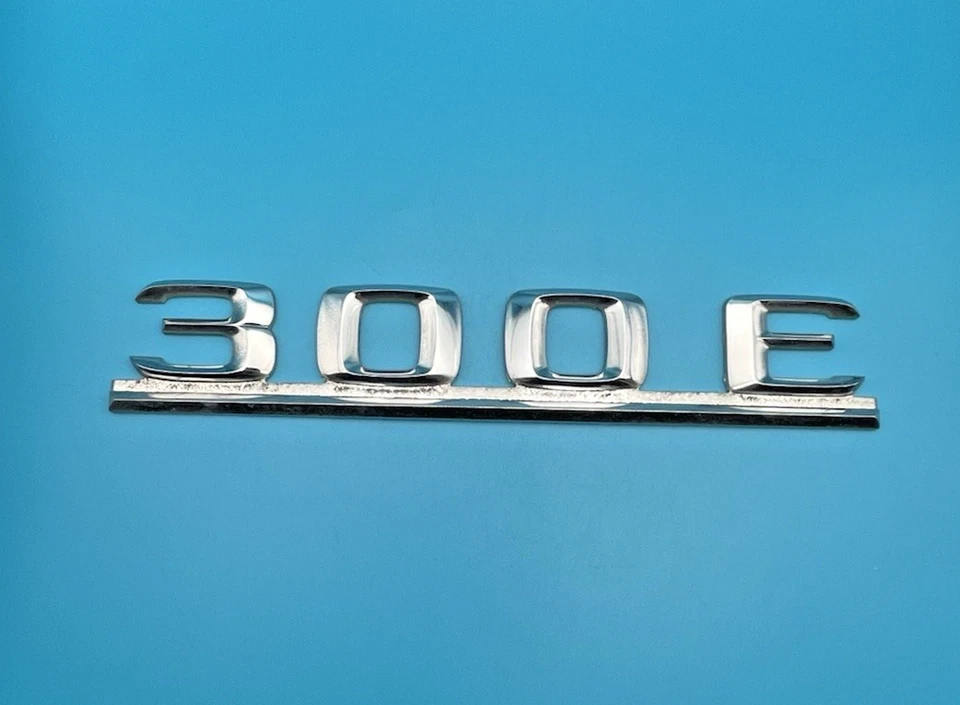 Mercedes Benz 300 E 1986-1993 tapa trasera maletero placa emblema cromo OEM Foto 3 de 4