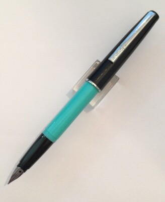 LUXOR TURQUOISE BLUE & BLACK FOUNTAIN PEN S/S FINE NIB USED W/STICKER ''HAPPY''?