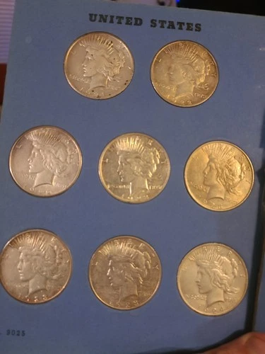 Complete Set of United States Silver Peace Dollars (24 coins in all) in Album