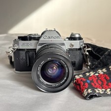 Canon AE-1 PROGRAM Silver/FD Camera Lens: Sigma UC Zoom 28-70mm w/strap UNTESTED