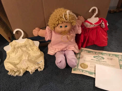 1983 Cabbage Patch Kid with two extra Cabbage Patch outfits