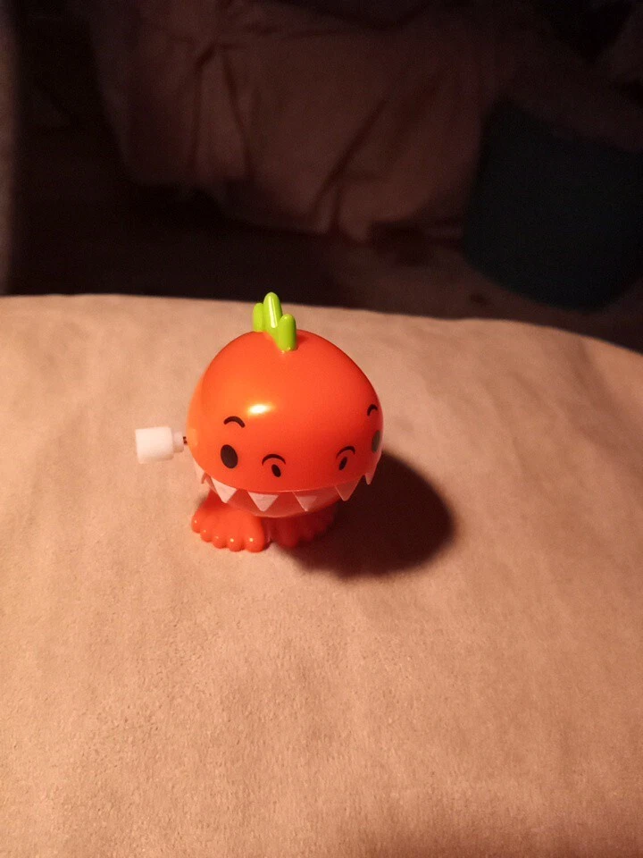 Brinquedo de corda dinossauro laranja - Imagem 4 de 4