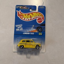 Hot Wheels London Taxi - 95510 Never Removed from Pack 1996 Yellow 1:64