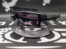   Oakley Gascan S, Polished Black Frame, Warm Grey Lens Gunmetal Icons
