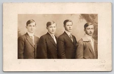 RPPC Four Handsome Young Men In Suits Portrait Real Photo Studio Postcard I32