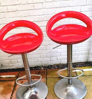 2x Red Plastic Bar Stools