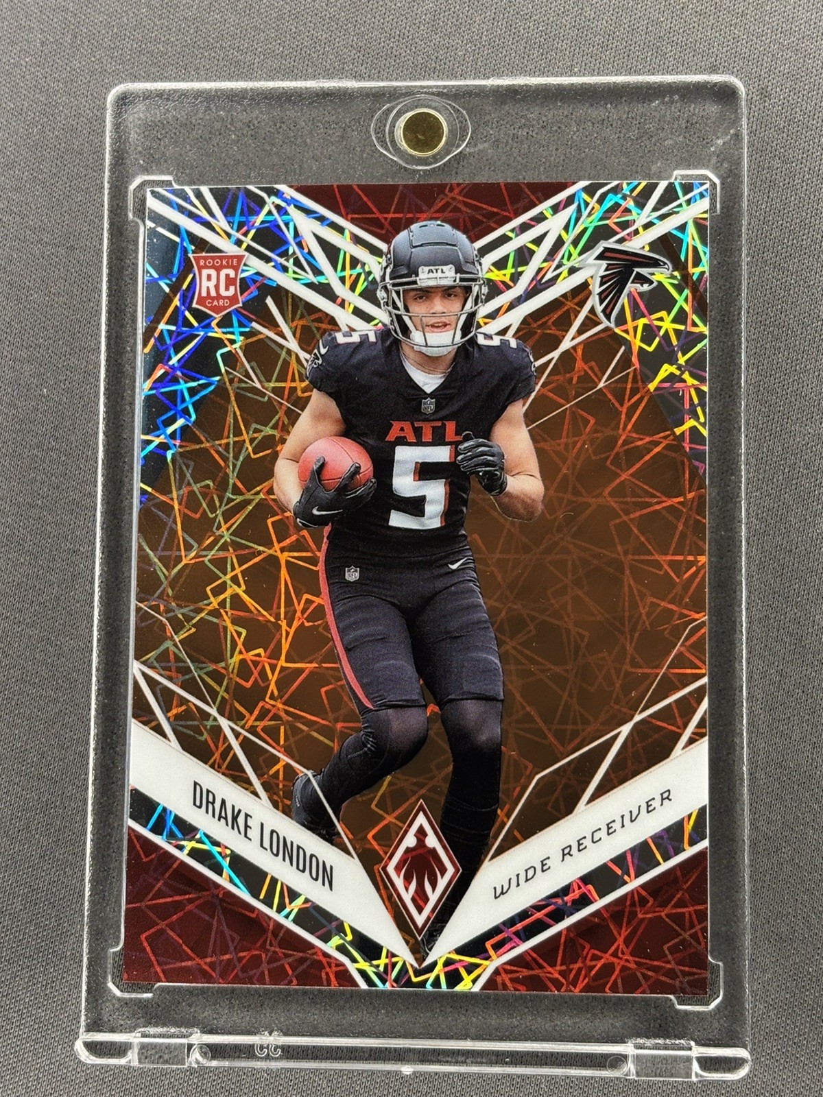 2022 Panini Phoenix Football Drake London Rookie Orange Lazer Holo RC /75 #107