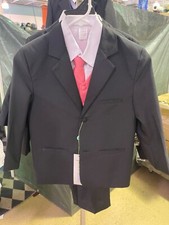 child  s suit. Black, peach vest and tie, white shirt, size 7. New Never worn.