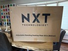 NXT Tech Adjustable Standing Desktop Riser 35in Black, New, unused open box. — photo 2