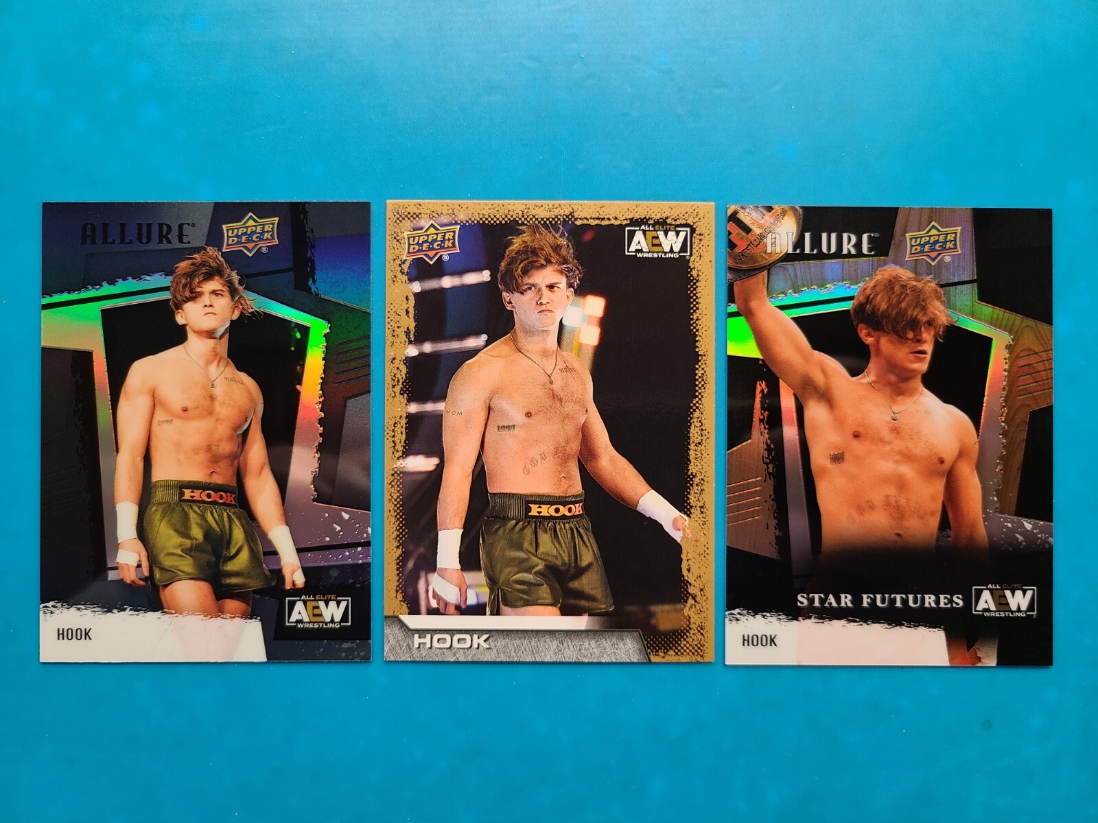 (3) 2022-23 Upper Deck AEW ALLURE HOOK #80 GOLD RC, #142 TABLE & BLACK RAINBOW.