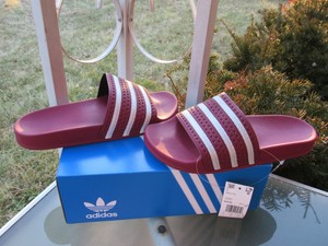 maroon adidas slides