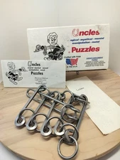 VTG UNCLES DISENTANGLEMENT BRAIN TEASER LADDER PUZZLE HEAVY METAL MADE USA