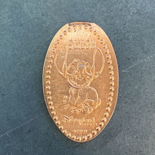 Disneyland point corps assis retraité allongé penny de collection - Photo 1 sur 4